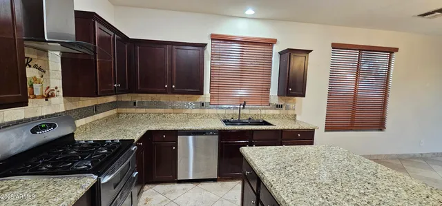 a kitchen with a stove and a sink