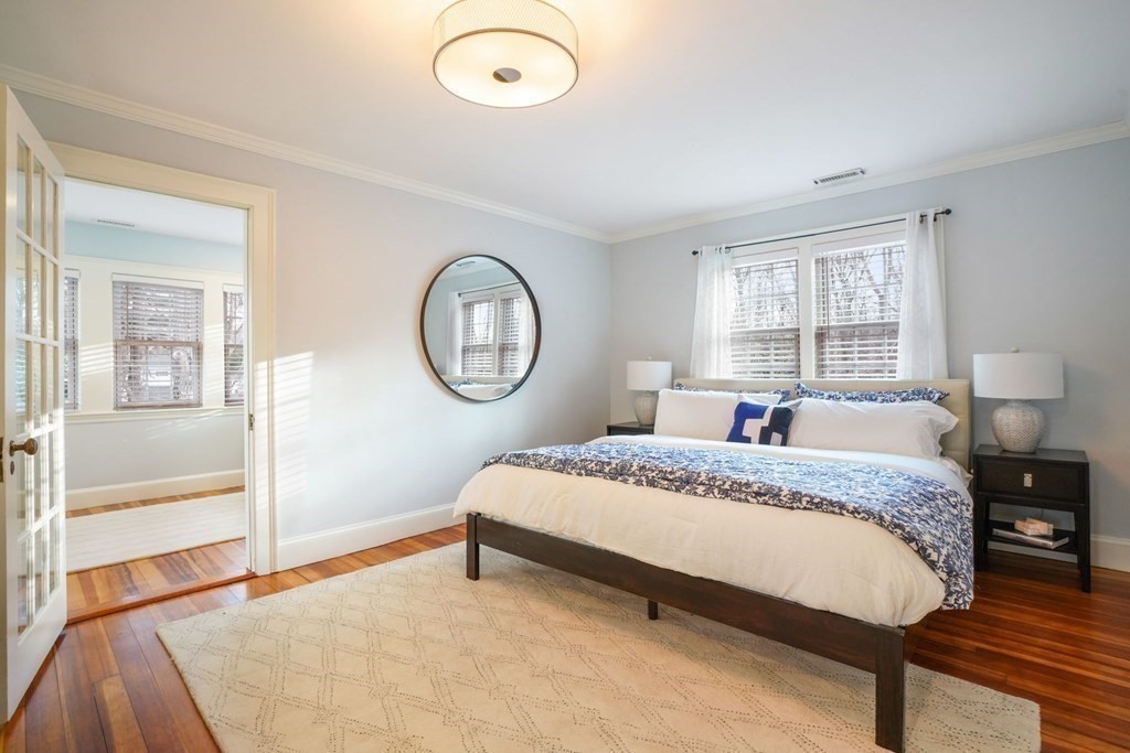 19 Vine Brook Road Lexington, MA 02421 - Photo 9 of 19 a spacious bedroom with a bed mirror and a window