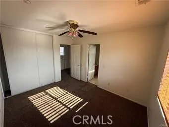 a view of a hallway with windows and stairs