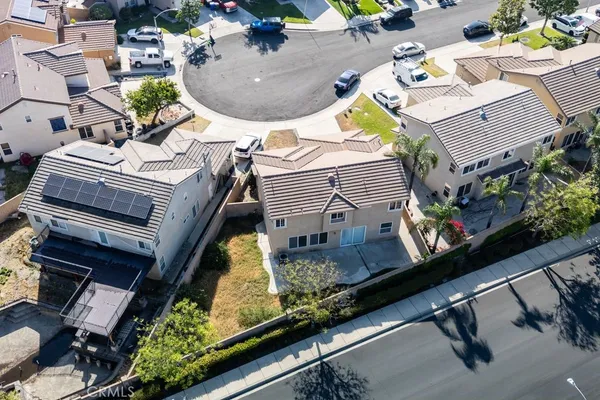 an aerial view of a house with a swimming pool