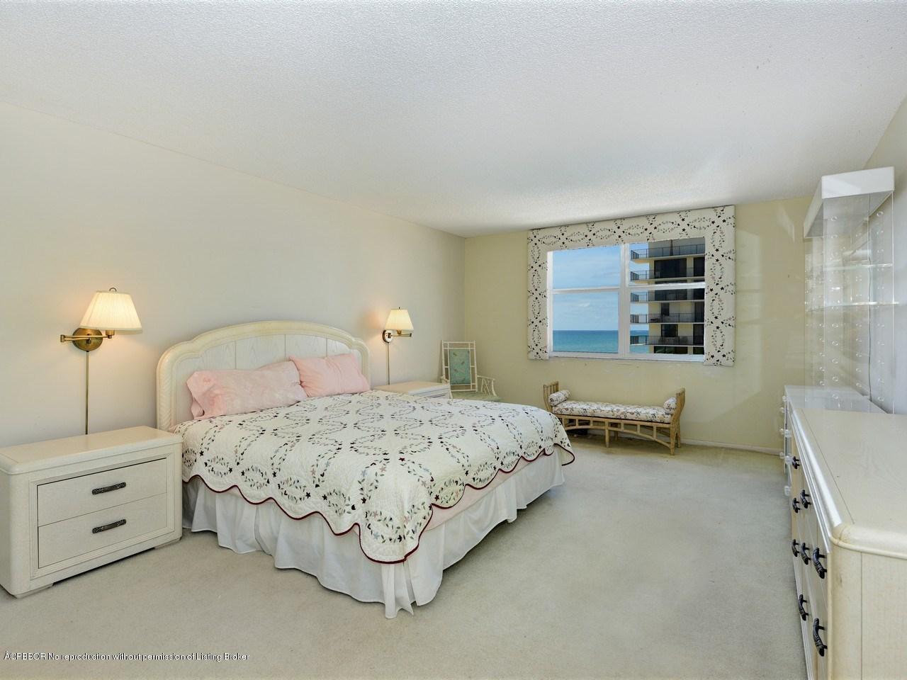 3450 South Ocean Boulevard, Unit 410 Palm Beach, FL 33480 - Photo 11 of 21 a bedroom with a bed and a night stand