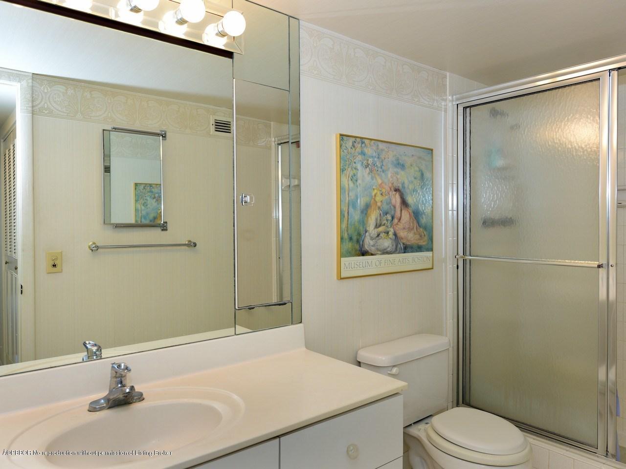 3450 South Ocean Boulevard, Unit 410 Palm Beach, FL 33480 - Photo 12 of 21 a bathroom with a sink toilet and shower