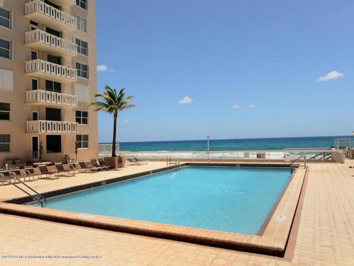 3450 South Ocean Boulevard, Unit 410 Palm Beach, FL 33480 - Photo 15 of 21 a kitchen with a sink and a counter top space