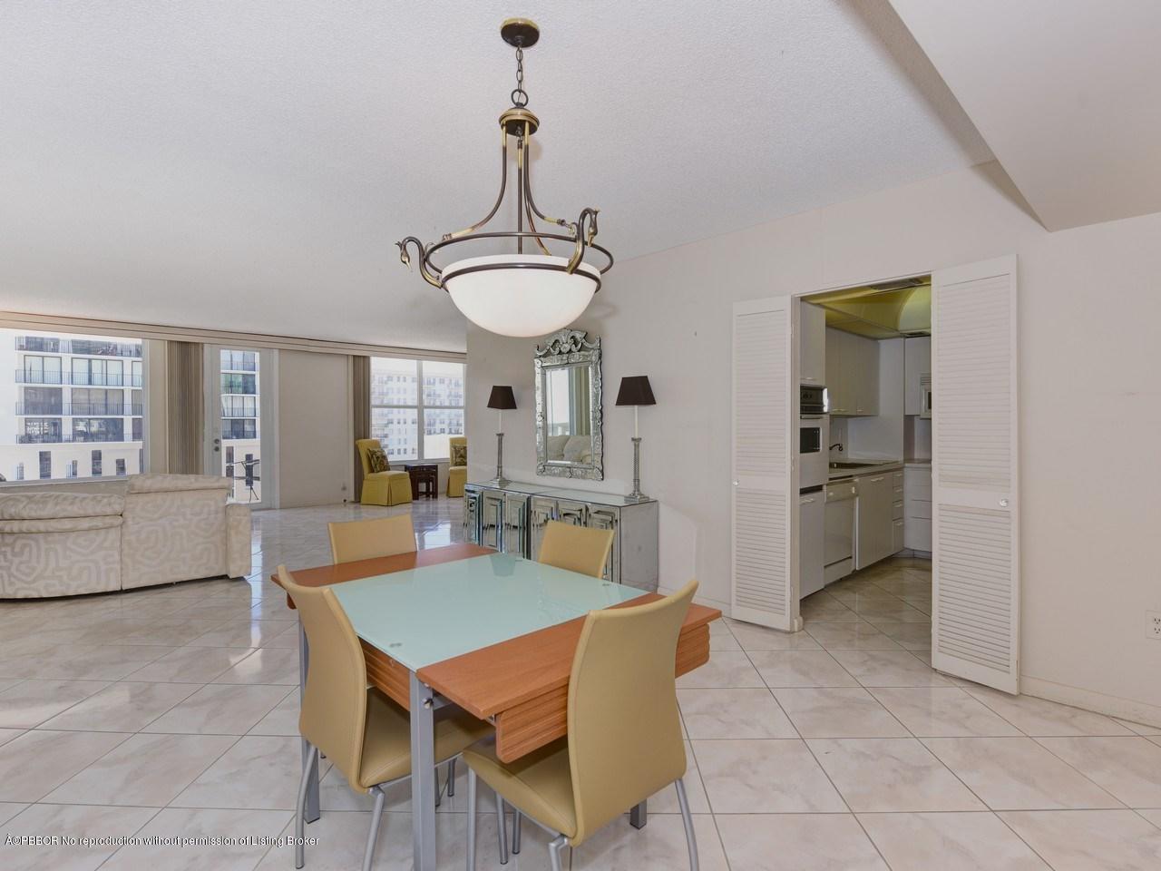 3450 South Ocean Boulevard, Unit 410 Palm Beach, FL 33480 - Photo 7 of 21 a view of a dining room with furniture window and wooden floor