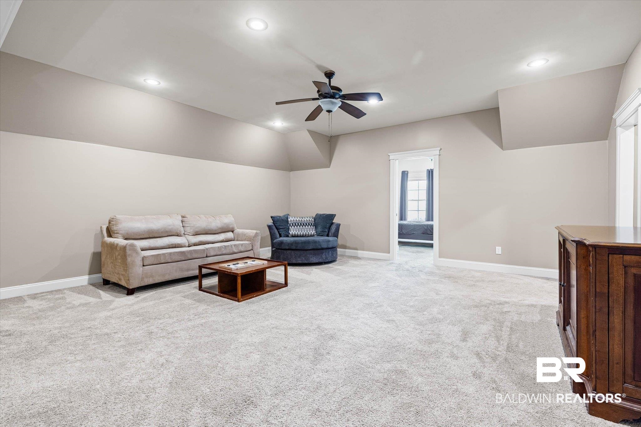 7676 Rockstone Lane Mobile, AL 36695 - Photo 27 of 47 Living room featuring a ceiling fan, light carpet, recessed lighting, and vaulted ceiling
