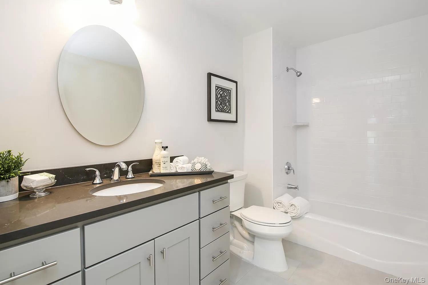314 Boulder Ridge Road South Salem, NY 10590 - Photo 11 of 26 a bathroom with a toilet a sink and a mirror