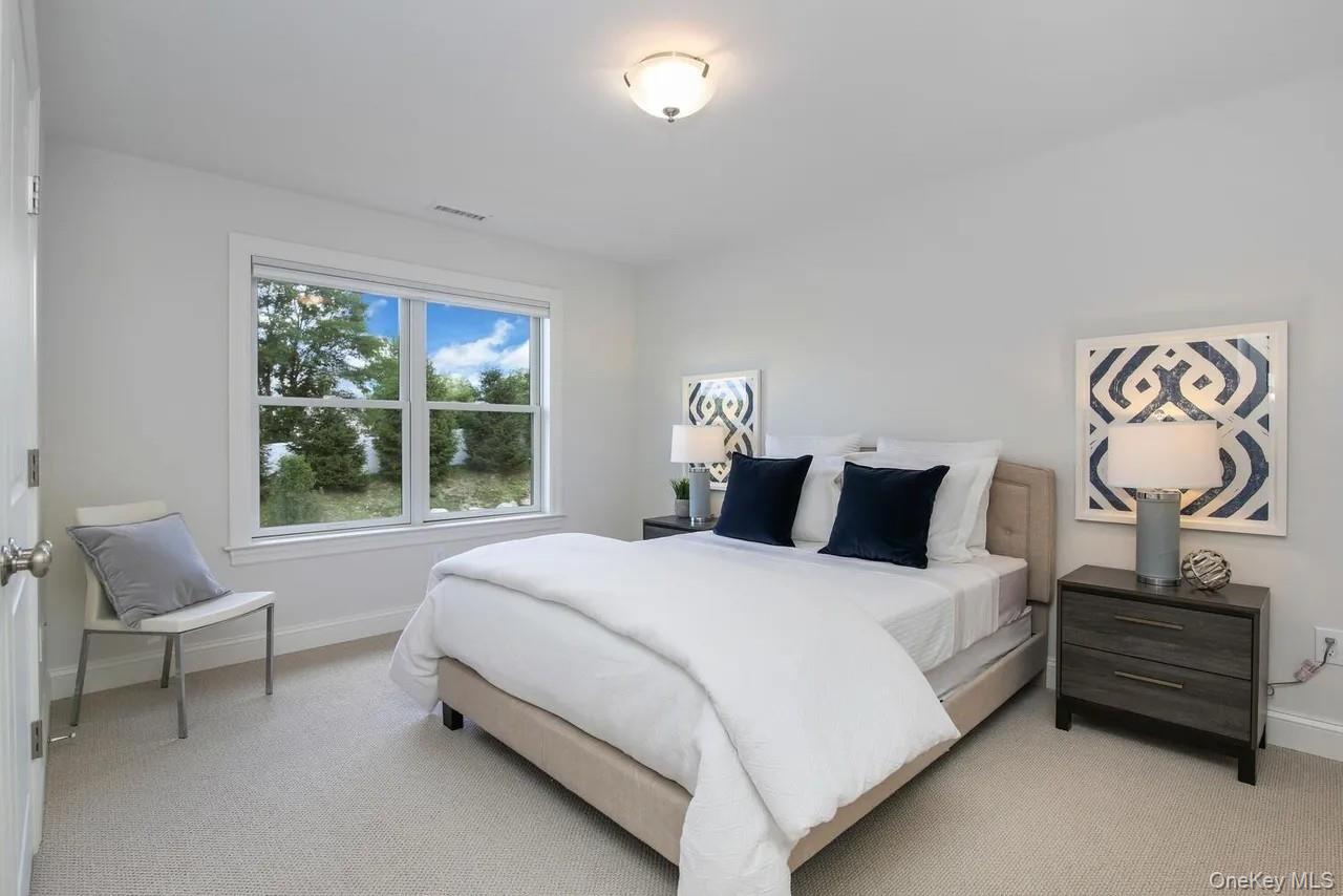 314 Boulder Ridge Road South Salem, NY 10590 - Photo 8 of 26 a bedroom with a bed and window