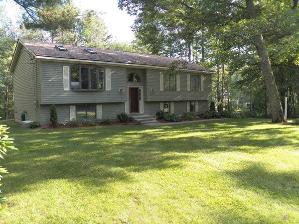 54 Juniper Road Ashburnham, MA 01430 - Photo 1 of 26 a view of a house with a swimming pool