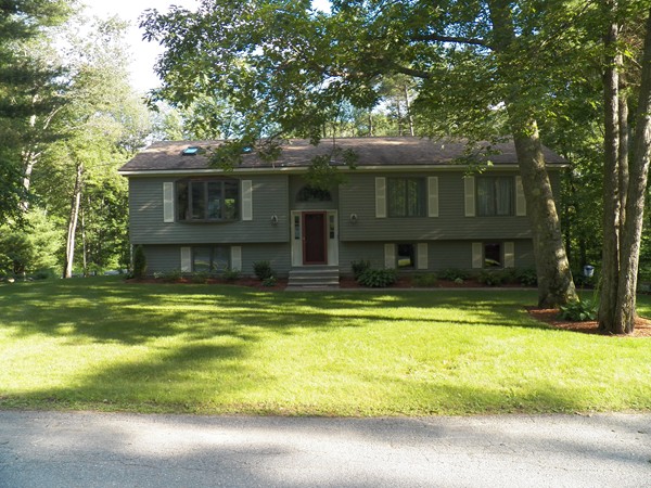 54 Juniper Road Ashburnham, MA 01430 - Photo 26 of 26 a front view of a house with a yard
