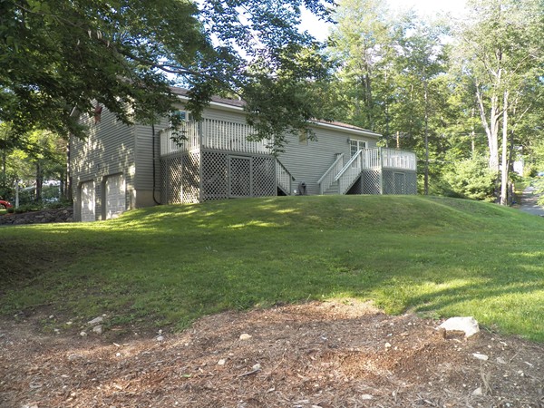 54 Juniper Road Ashburnham, MA 01430 - Photo 4 of 26 a backyard of a house with lots of green space