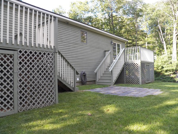 54 Juniper Road Ashburnham, MA 01430 - Photo 5 of 26 a view of a backyard with wooden fence
