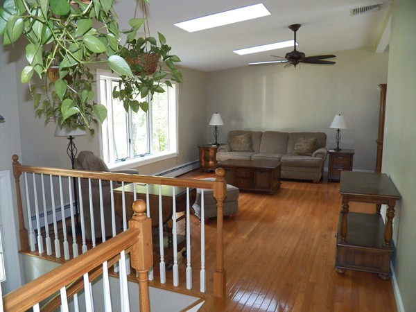 54 Juniper Road Ashburnham, MA 01430 - Photo 7 of 26 a living room with furniture and a potted plant