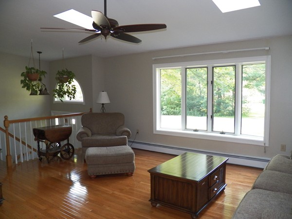 54 Juniper Road Ashburnham, MA 01430 - Photo 8 of 26 a living room with furniture and a large window