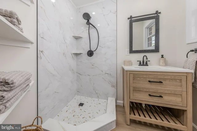 a bathroom with a sink a vanity and a mirror