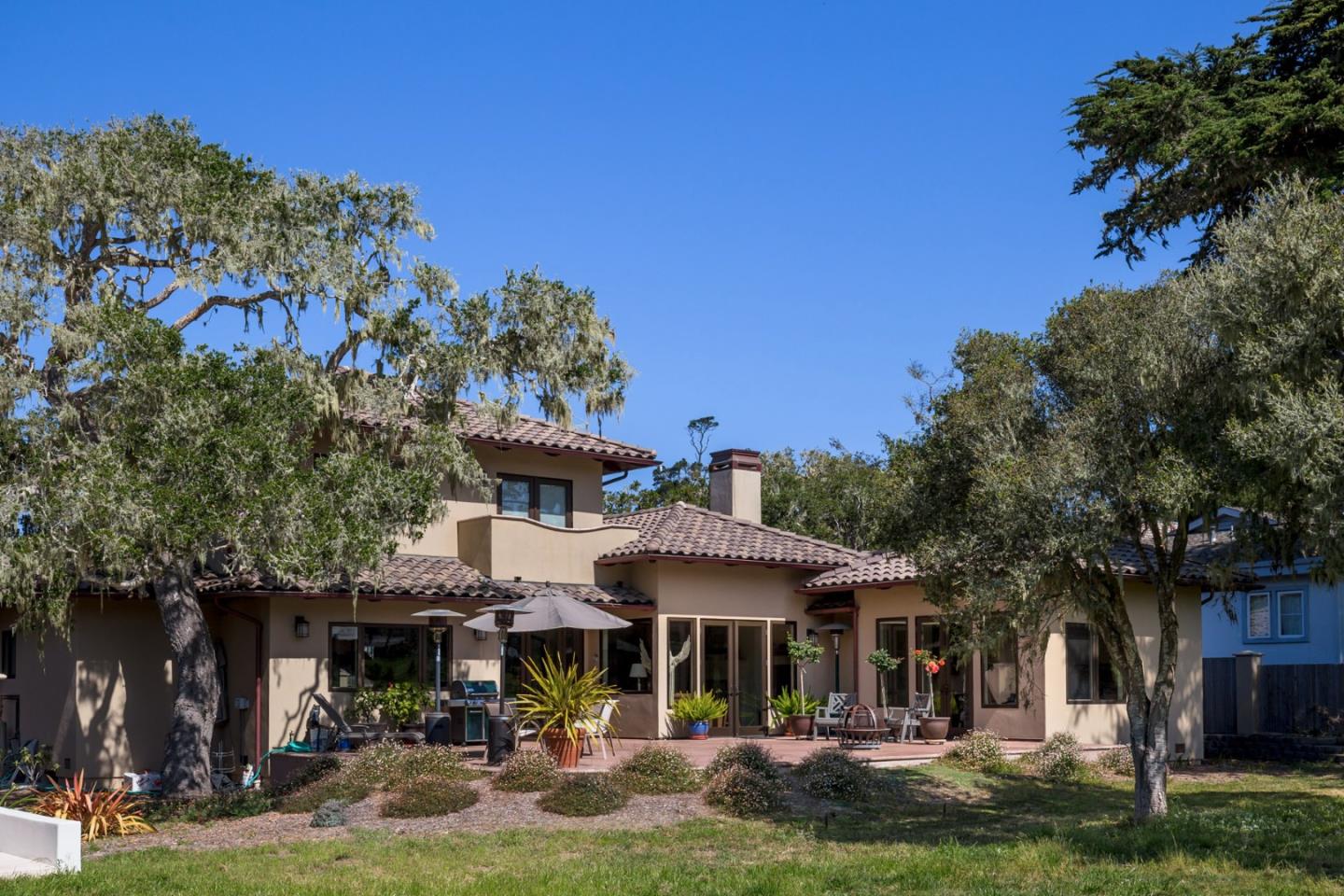 1048 Rodeo Road Pebble Beach, CA 93953 - Photo 16 of 16 a front view of a building with a garden