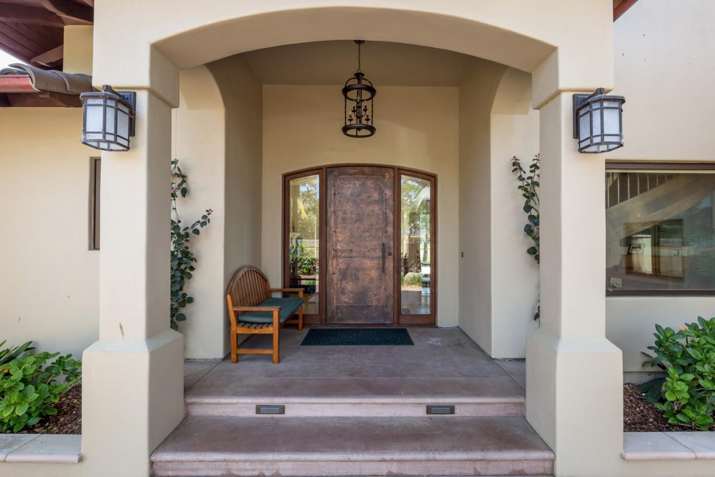 1048 Rodeo Road Pebble Beach, CA 93953 - Photo 3 of 16 a front view of a house with a yard