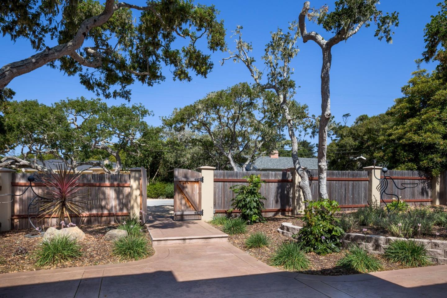 1048 Rodeo Road Pebble Beach, CA 93953 - Photo 4 of 16 front view of a house with a tree