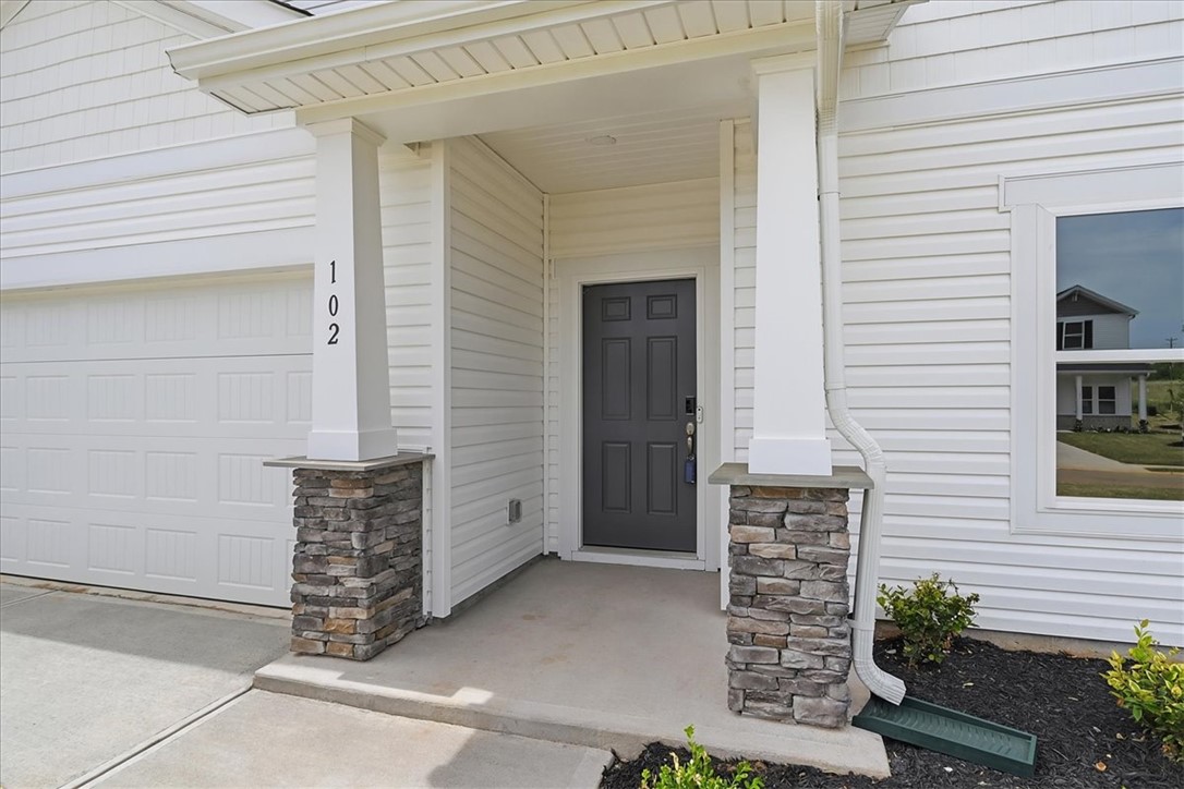 102 Gibbon Way Gray Court, SC 29645 - Photo 2 of 49 Welcome to this charming residence, boasting a welcoming front entrance with inviting curb appeal.