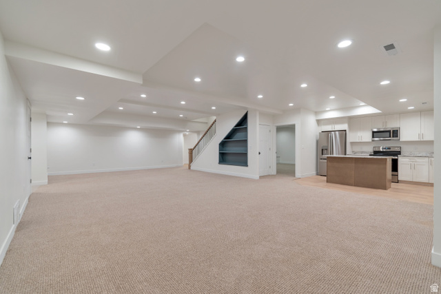 1820 West Farmhouse Flats Road Peoa, UT 84061 - Photo 39 of 79 Expansive open-concept living area featuring plush carpeting and recessed lighting