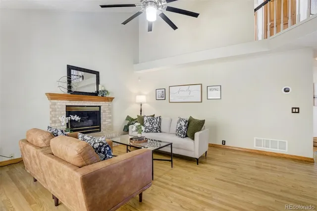 a view of a livingroom with furniture and staircase