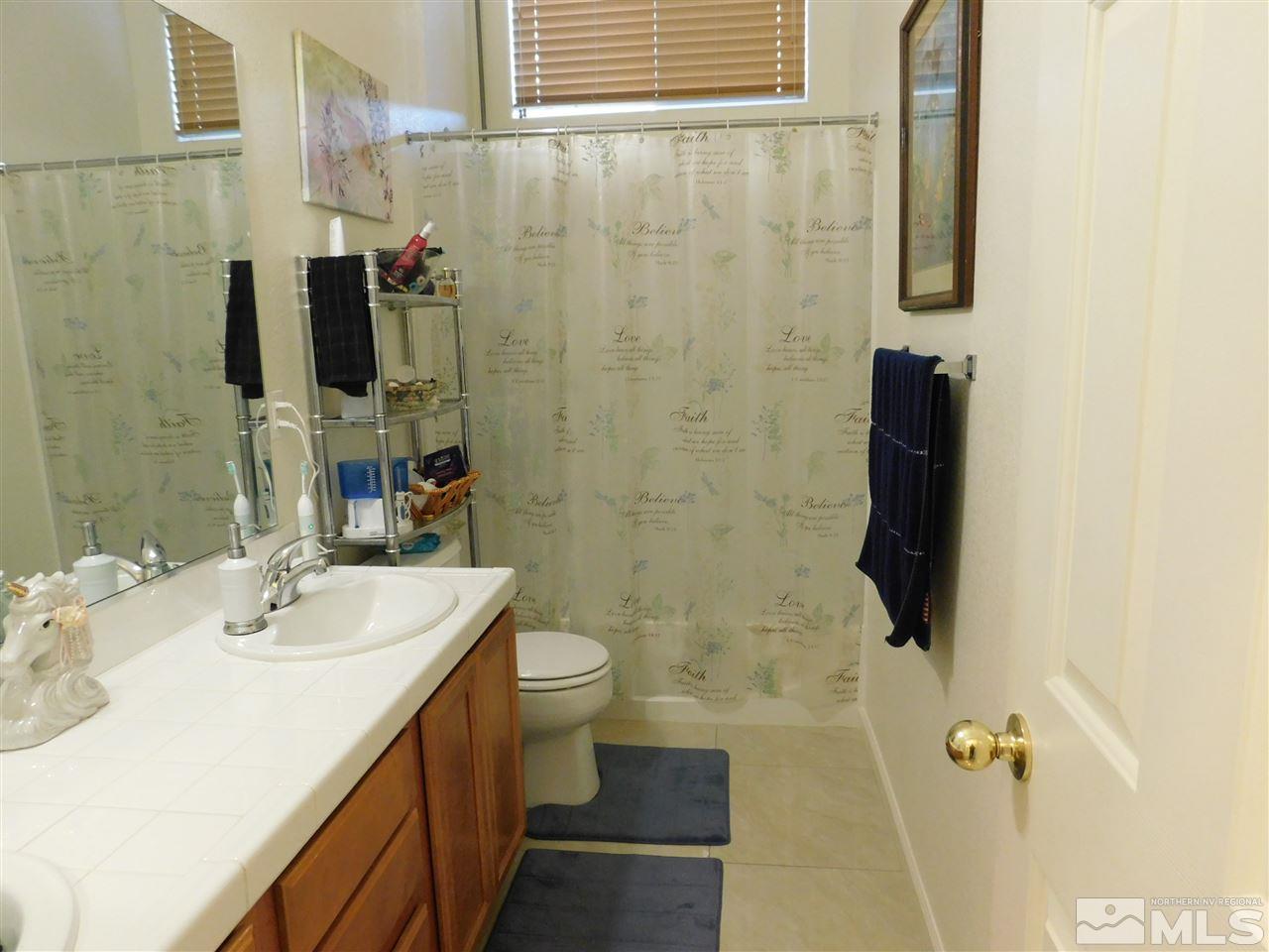 5030 Hitch Road Reno, NV 89506 - Photo 17 of 20 a bathroom with a sink toilet and shower