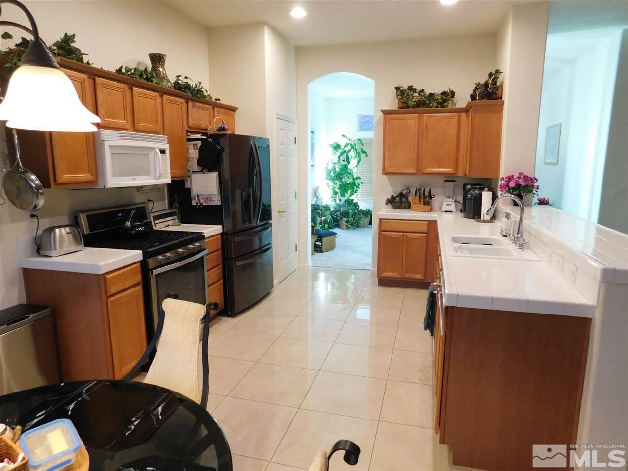 5030 Hitch Road Reno, NV 89506 - Photo 9 of 20 a kitchen with a sink appliances and cabinets