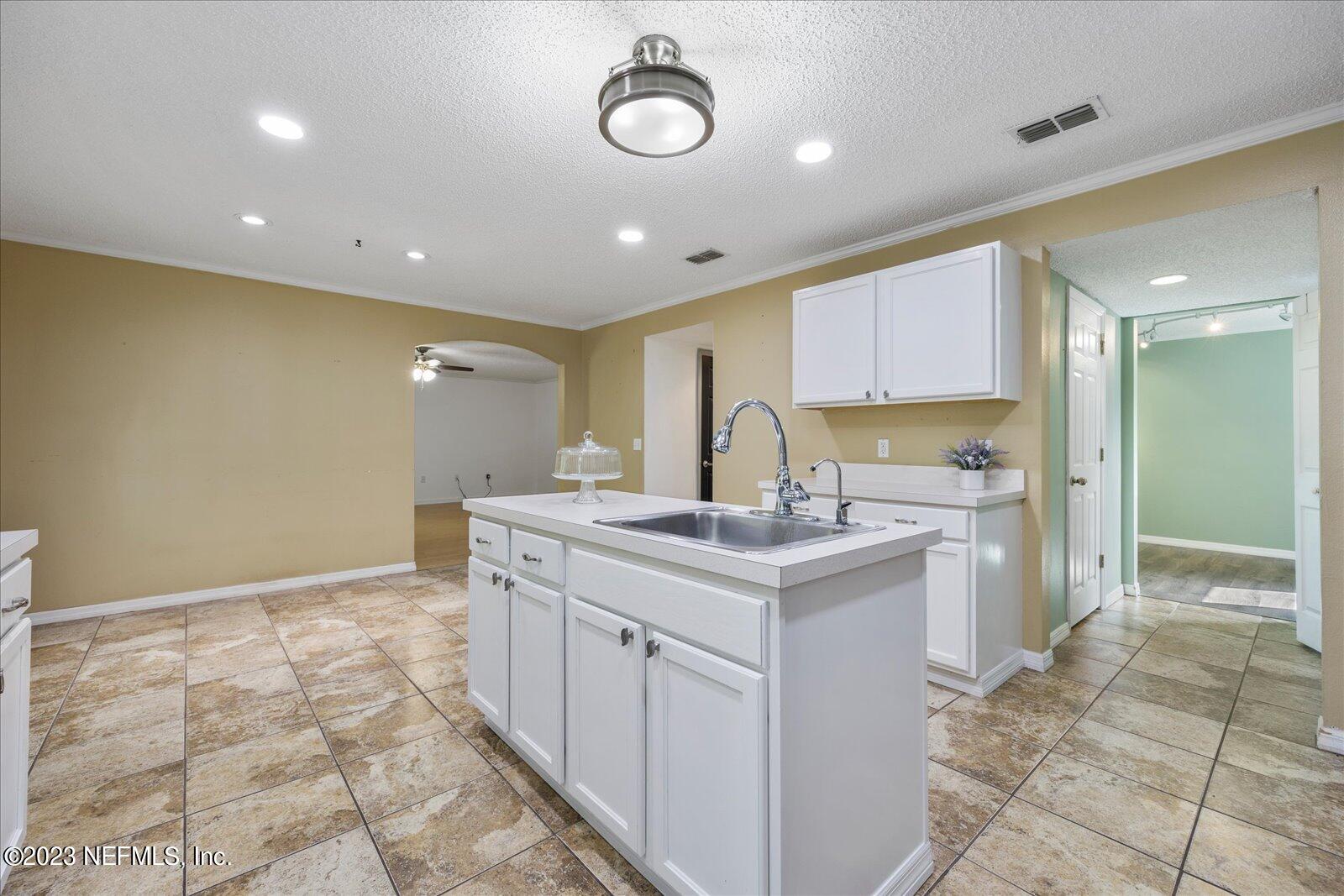 55703 Bear Run Road Callahan, FL 32011 - Photo 12 of 58 a kitchen with a sink and cabinets
