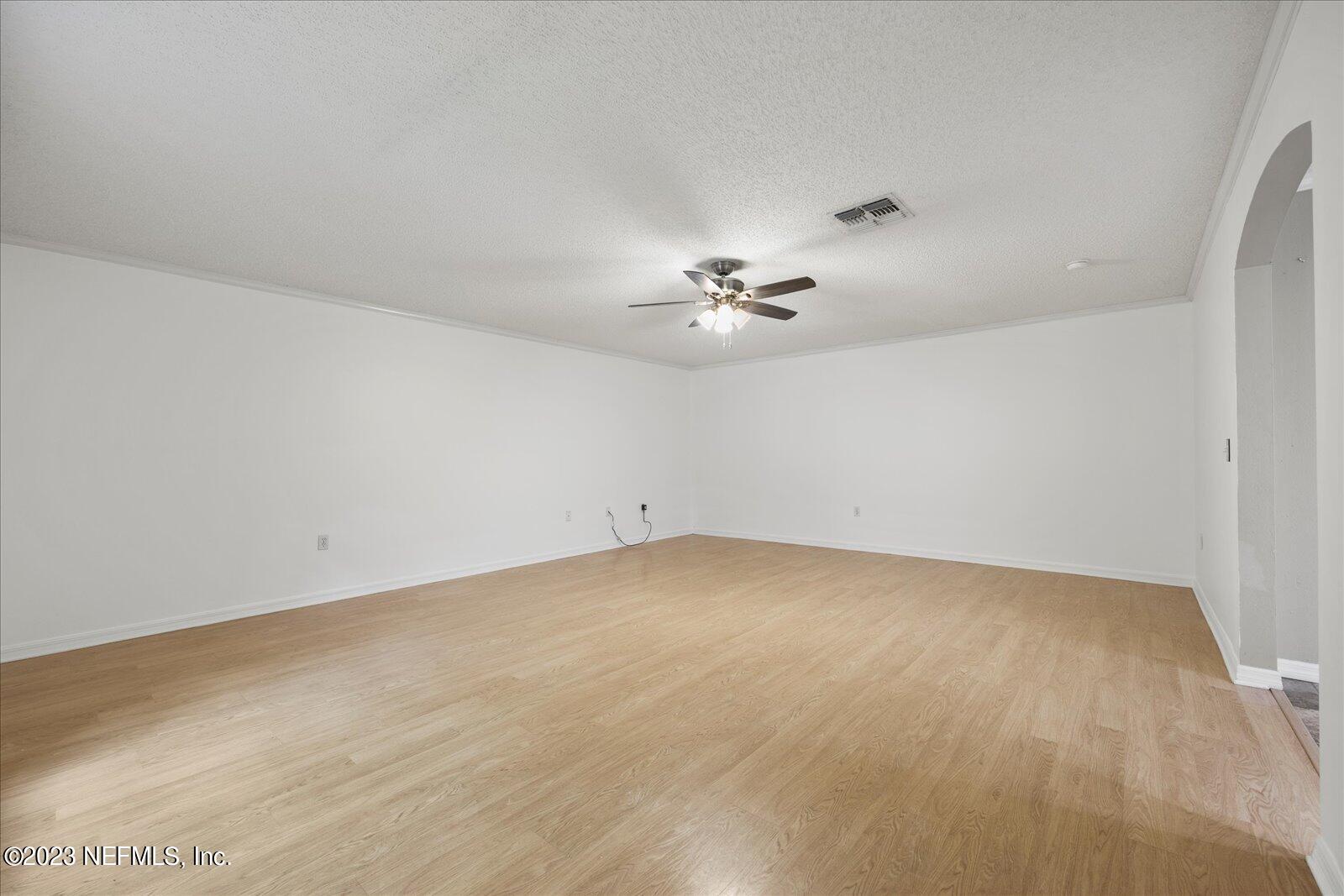 55703 Bear Run Road Callahan, FL 32011 - Photo 19 of 58 a view of an empty room with a chandelier fan