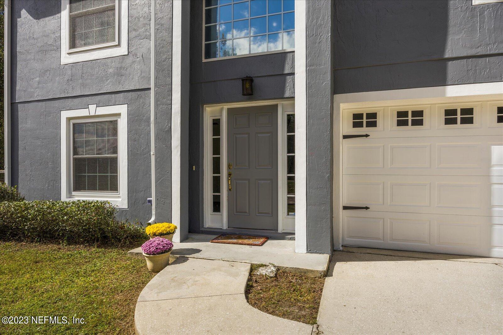 55703 Bear Run Road Callahan, FL 32011 - Photo 2 of 58 a front view of a house with a porch