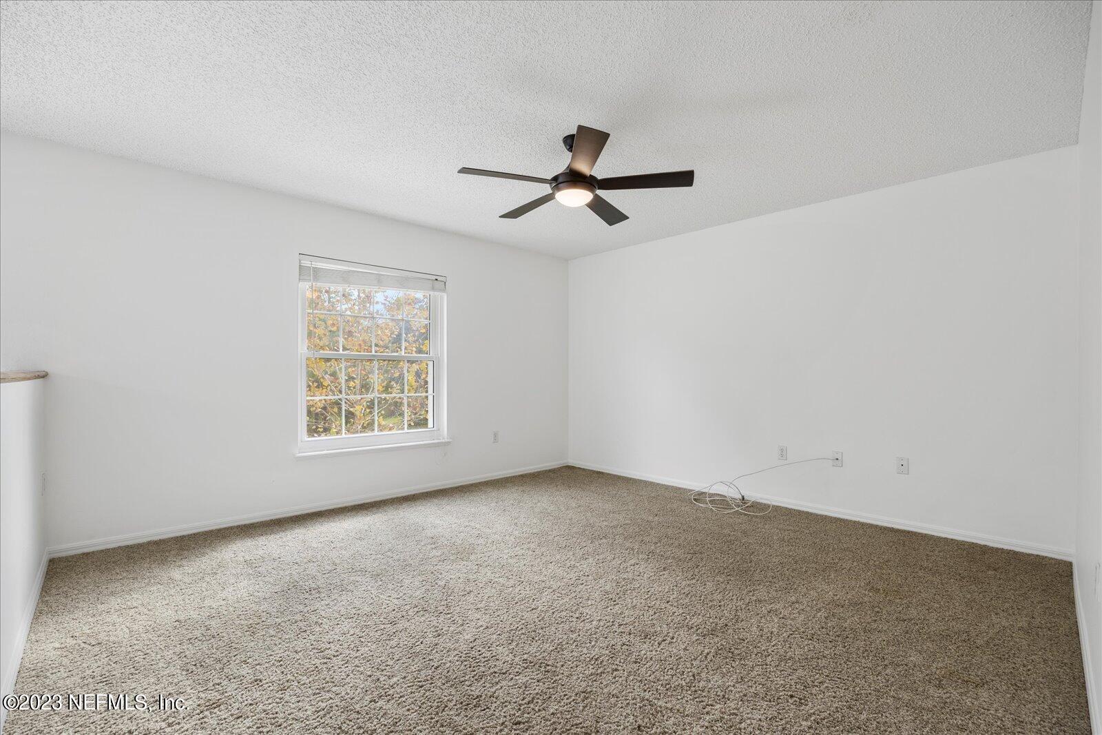 55703 Bear Run Road Callahan, FL 32011 - Photo 23 of 58 wooden floor in an empty room with a window