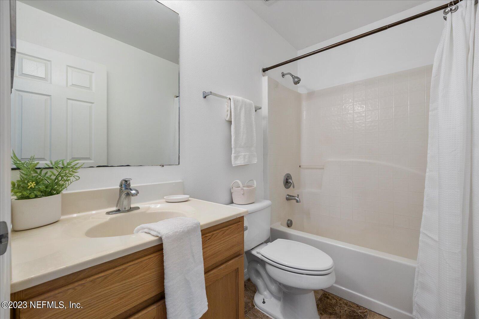 55703 Bear Run Road Callahan, FL 32011 - Photo 38 of 58 a bathroom with a sink toilet and shower