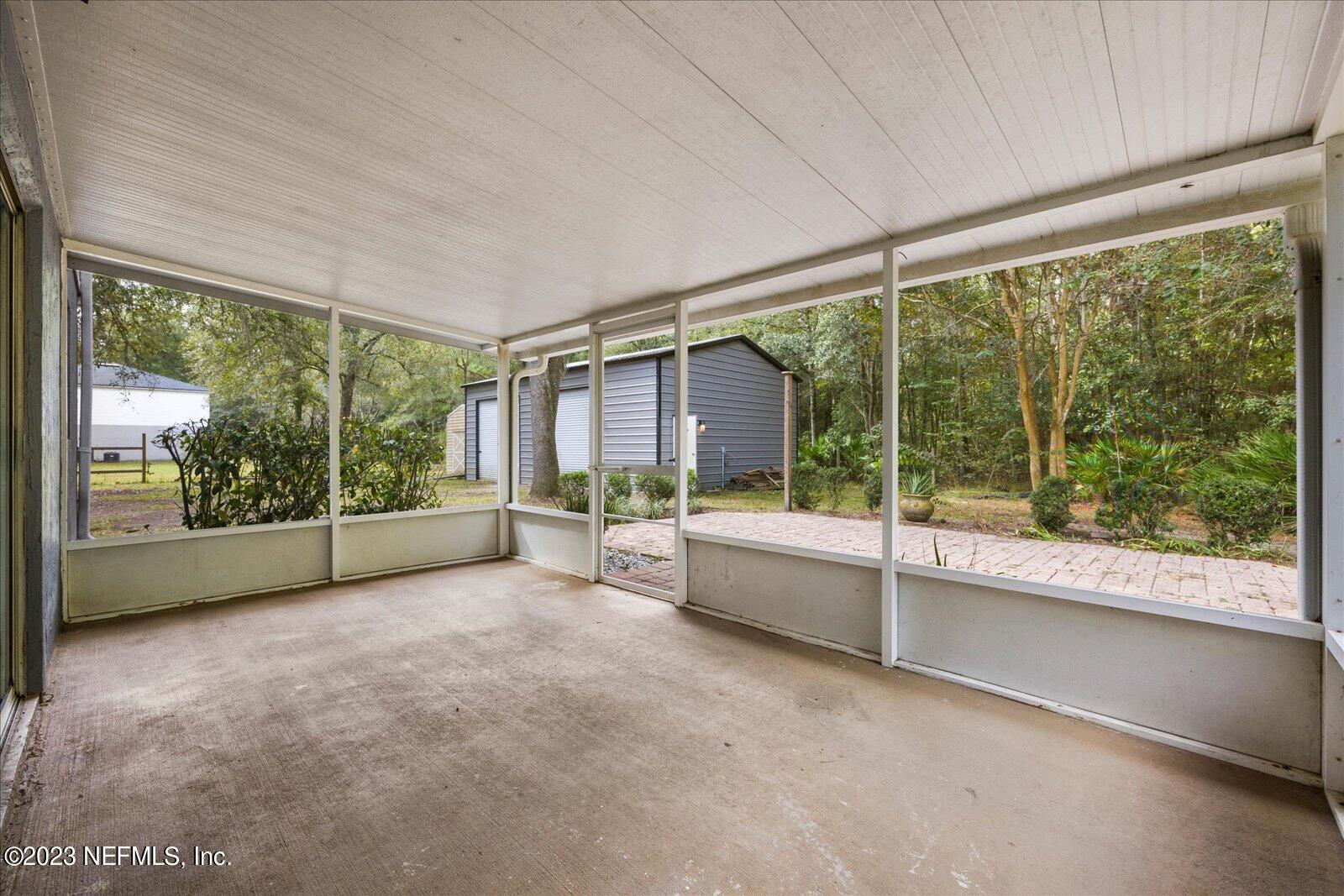 55703 Bear Run Road Callahan, FL 32011 - Photo 40 of 58 a view of an empty room with windows and city view
