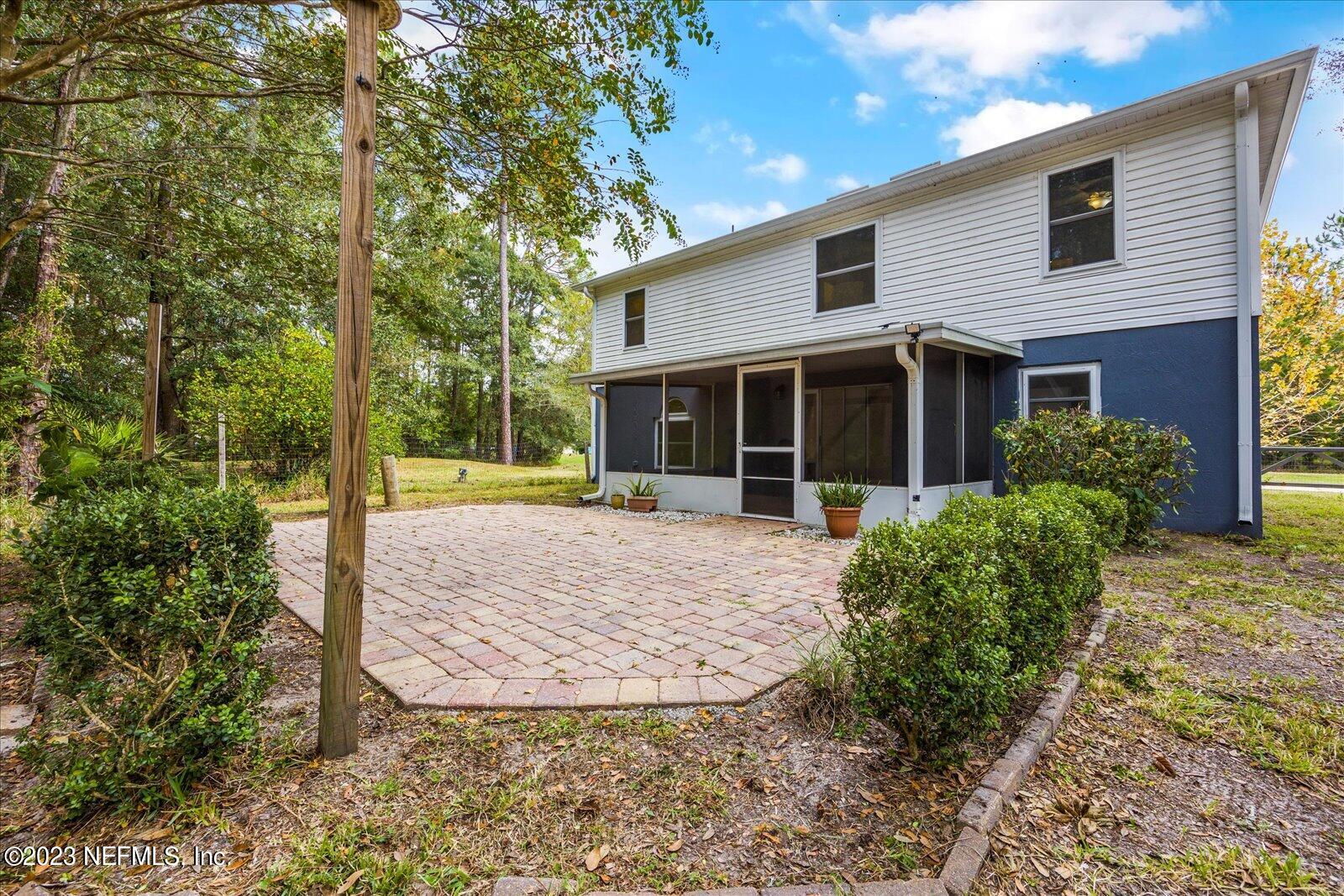 55703 Bear Run Road Callahan, FL 32011 - Photo 42 of 58 a view of a house with backyard and garden