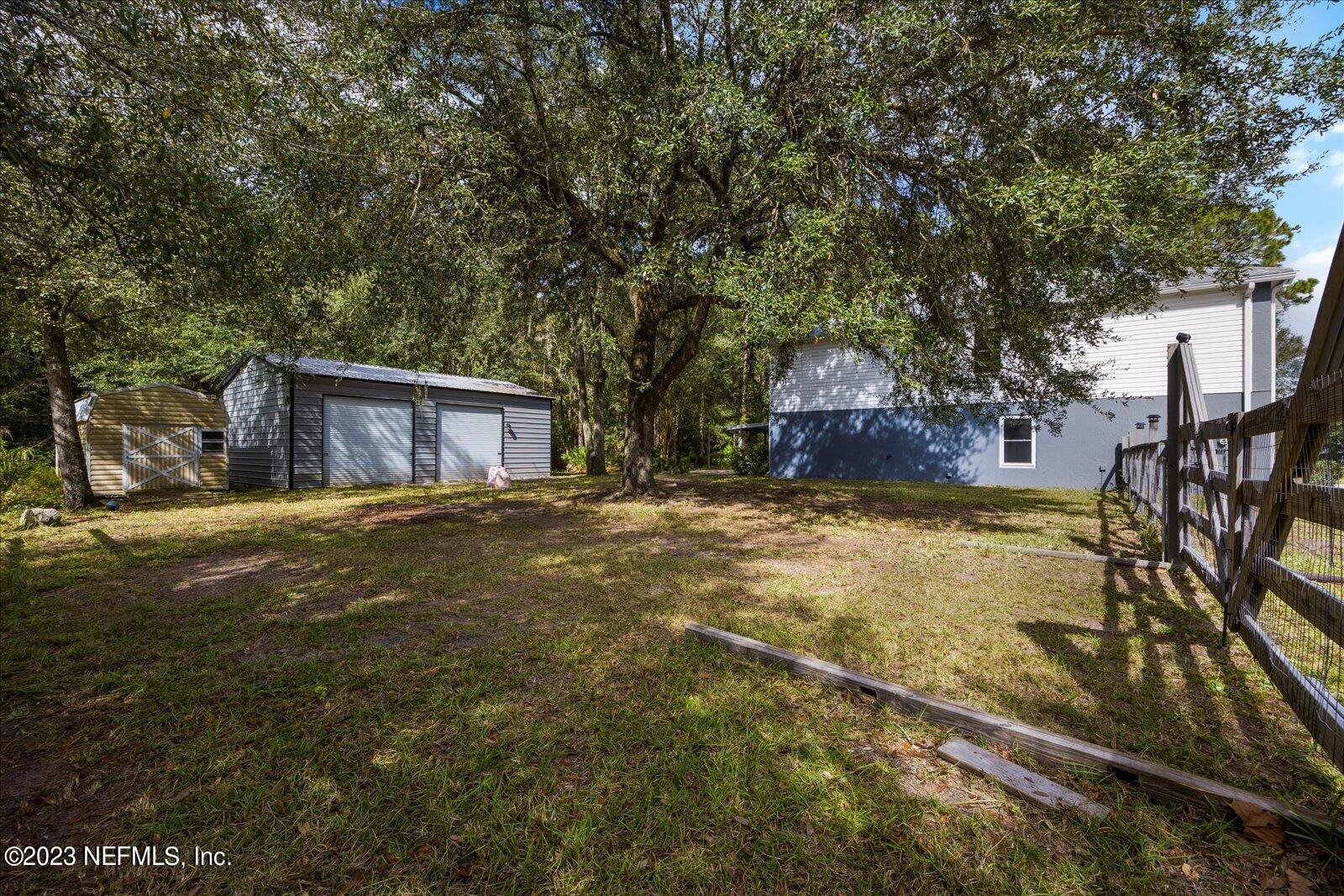 55703 Bear Run Road Callahan, FL 32011 - Photo 45 of 58 a house view with a swimming pool