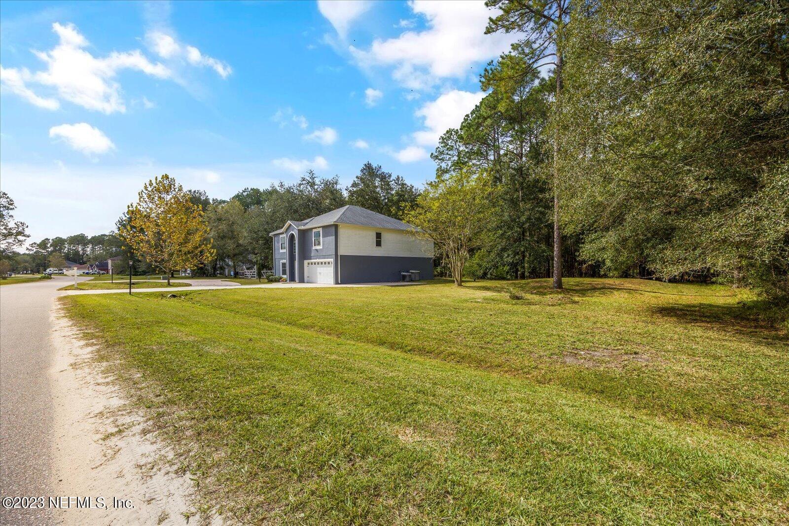 55703 Bear Run Road Callahan, FL 32011 - Photo 47 of 58 a house view with a outdoor space