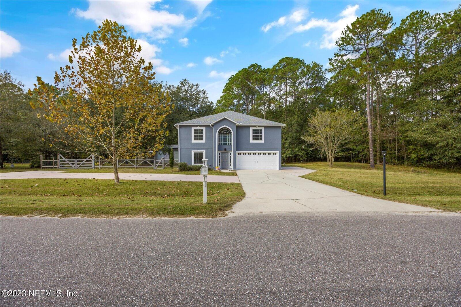 55703 Bear Run Road Callahan, FL 32011 - Photo 48 of 58 a swimming pool with outdoor seating and yard