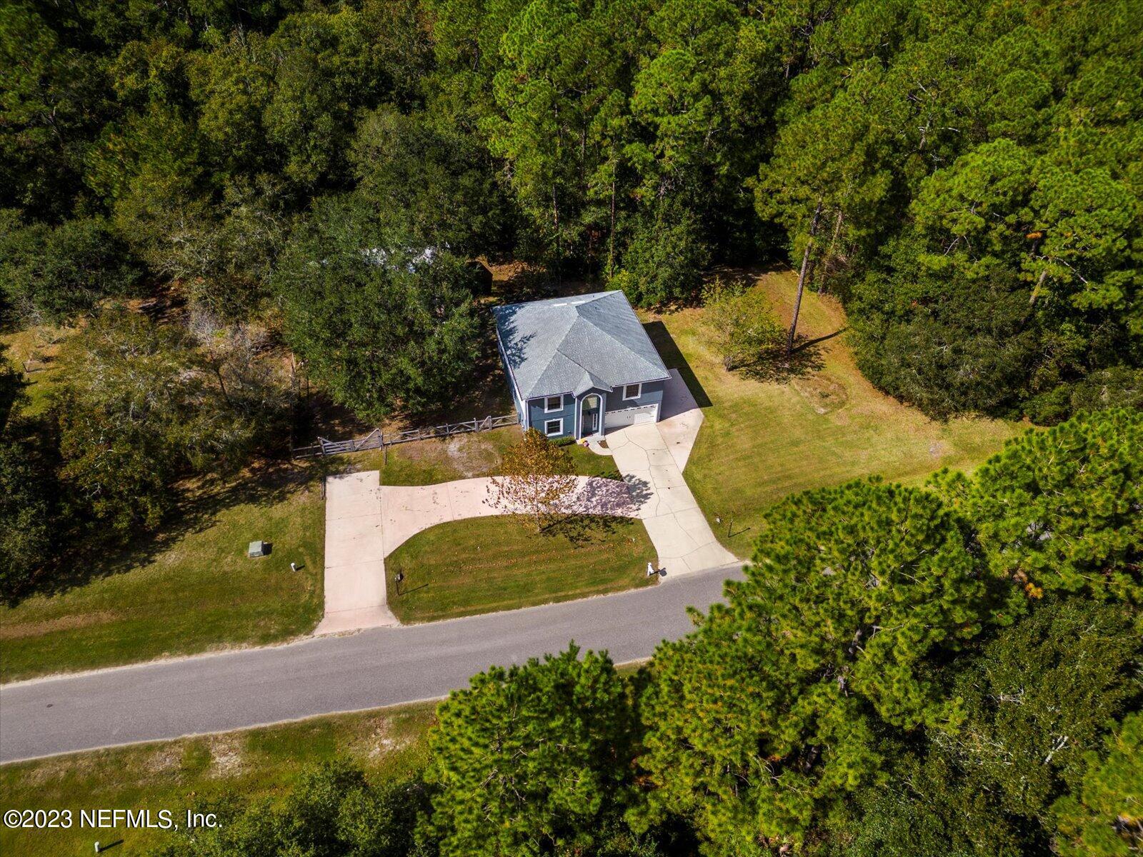 55703 Bear Run Road Callahan, FL 32011 - Photo 51 of 58 an aerial view of a house with yard swimming pool and outdoor seating