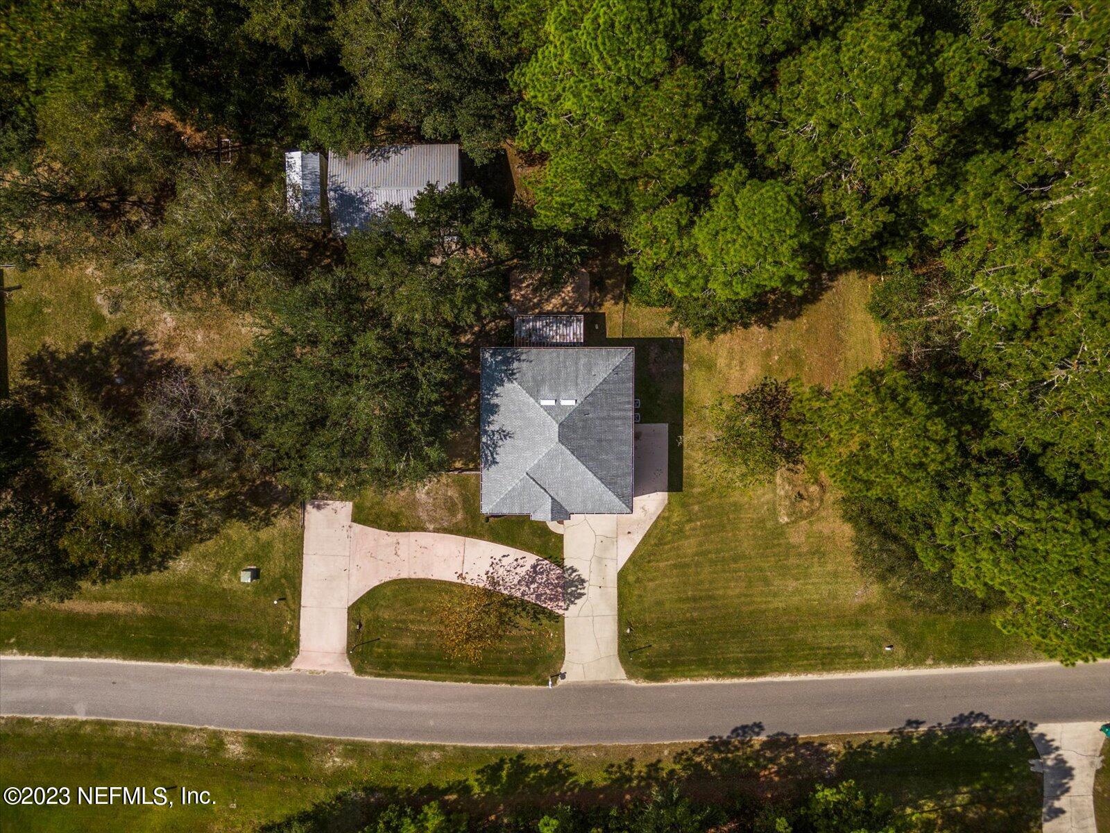 55703 Bear Run Road Callahan, FL 32011 - Photo 52 of 58 an aerial view of residential houses with outdoor space