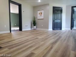 1990 Tabor Ridge Road Northeast New Philadelphia, OH 44663 - Photo 6 of 8 View of hardwood floored spare room