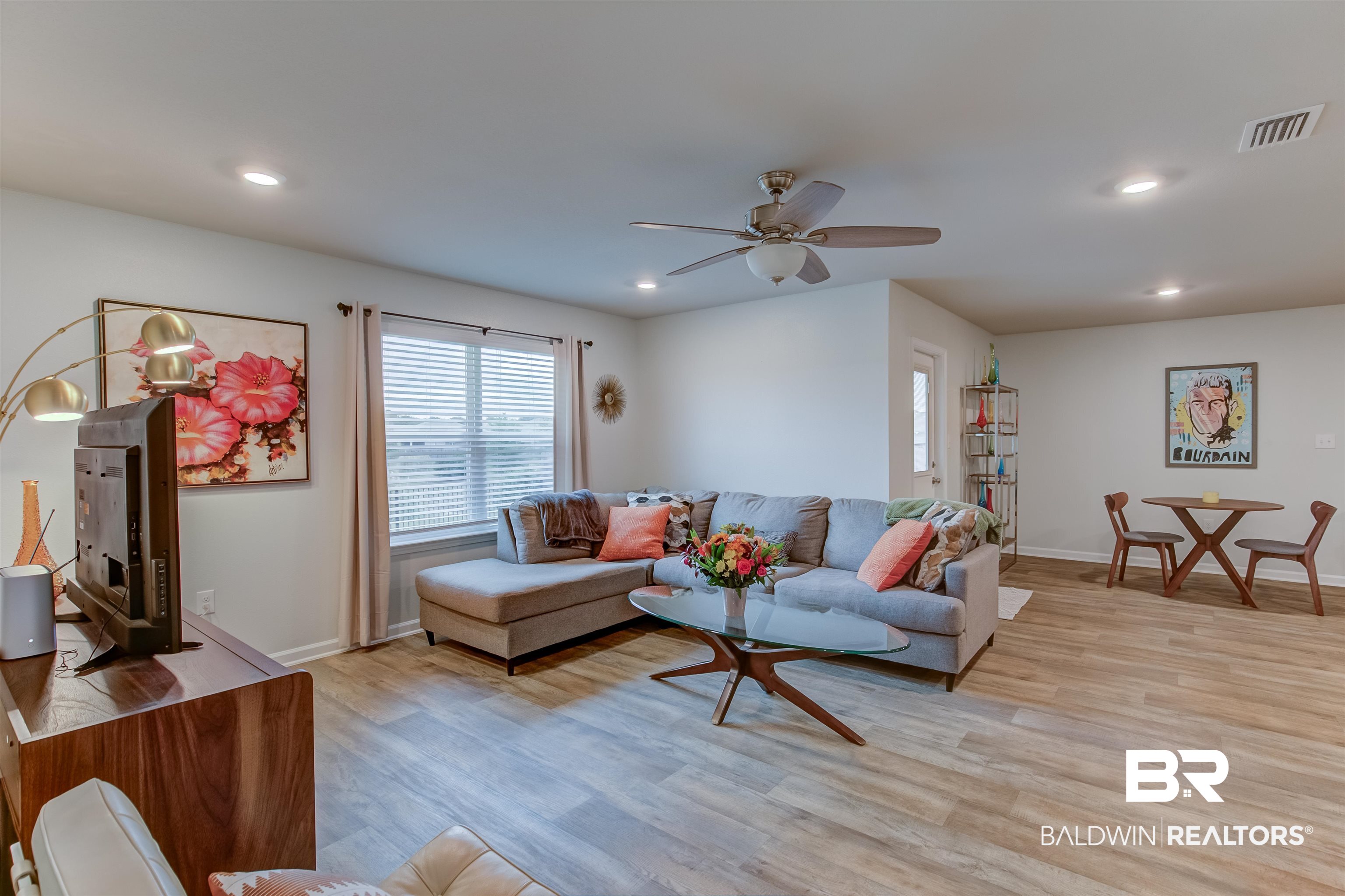 8033 Irwin Loop Daphne, AL 36526 - Photo 14 of 38 Expansive open-concept living area featuring wood-finish flooring, recessed lighting, and a ceiling fan