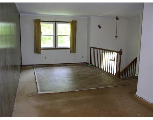 97 Bartholomew Road Mercer, PA 16137 - Photo 14 of 17 Living Room. Living room, dining room, hallway and kitchen all need new flooring.