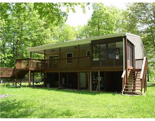 97 Bartholomew Road Mercer, PA 16137 - Photo 8 of 17 Exterior Back. View showing the sunroom and deck area.