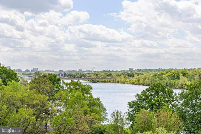 a view of a lake with houses in the back