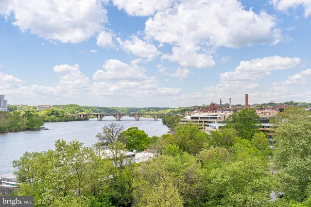 a view of a lake with houses in the back