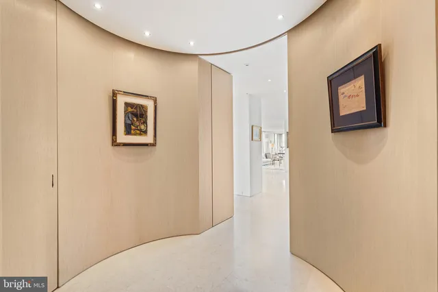 a view of a hallway with an entryway