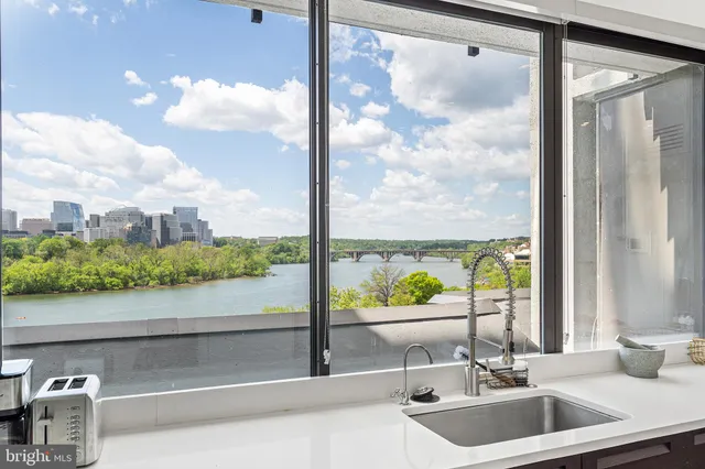 a bathroom with a sink and a large window