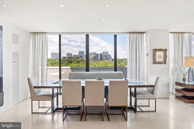 a view of a dining room with furniture window and outside view