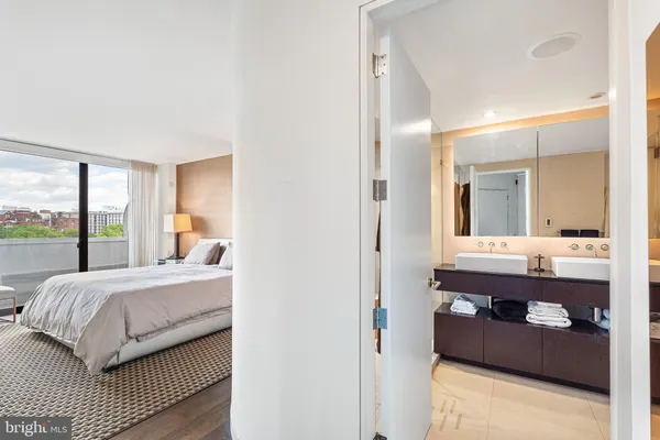a room with a bed and a mirror