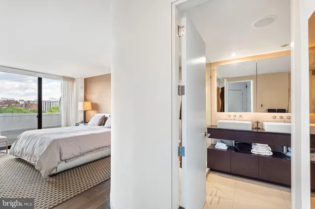 a room with a bed and a mirror