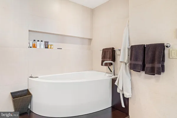 a white bath tub sitting in a bathroom